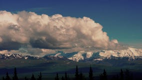 Clouds Pass Over the Peaks of The Denali Range Alaska