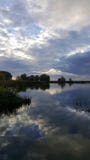 Cloudy evening on the lake stock images