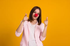 Young cute girl as a clown, studio stock photo Young cute girl as a clown, studio stock photo
