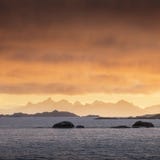 Coast of the of Norwegian fjords at sunset near Tromso Norway. Winter morning after sunrise. Lofoten. Christmas time. royalty free stock images Coast of the of Norwegian fjords at sunset near Tromso Norway. Winter morning after sunrise. Lofoten. Christmas time. royalty free stock images