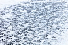 Cobblestone pavement covered with snow and ice stock images Cobblestone pavement covered with snow and ice stock images