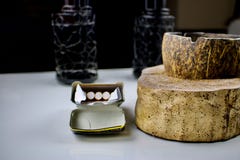 Coconut ashtray near cigarettes stock image Coconut ashtray near cigarettes stock image