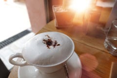 Coffee, Cappuccino With A White Cup, Fluffy White Milk On Top. Cappuccino Coffee Cup And Spoon / Composition Of Cup Of Cappuccino Stock Photography Coffee, Cappuccino With A White Cup, Fluffy White Milk On Top. Cappuccino Coffee Cup And Spoon / Composition Of Cup Of Cappuccino Stock Photography
