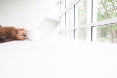 Coffee cup handle And white notepad for work beside the window stock images Coffee cup handle And white notepad for work beside the window stock images