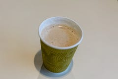 Coffee with milk in a paper glass stock image Coffee with milk in a paper glass stock image