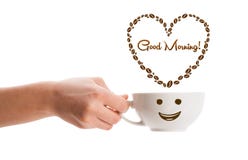 Coffee mug with coffee beans shaped heart with good morning sign Stock Photography Coffee mug with coffee beans shaped heart with good morning sign Stock Photography