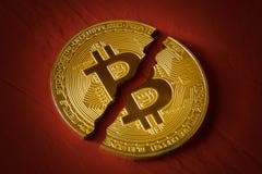 Coin Bitcoin Is Broken In Half On Red Background. The Fall And Collapse Of The Course Of The Crypto Currency, The Ban On Trade Stock Photography
