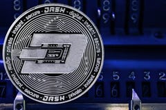 Coin cryptocurrency Dash against the numbers of the arithmometer. stock photos Coin cryptocurrency Dash against the numbers of the arithmometer. stock photos