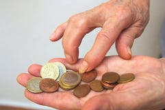 Coins in the palm of an older woman`s hand royalty free stock photos Coins in the palm of an older woman`s hand royalty free stock photos