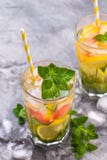 Cold refreshing summer lemonade in a glass on a grey concrete or stone background. stock photography Cold refreshing summer lemonade in a glass on a grey concrete or stone background. stock photography