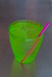 Cold water in green plastic cup on Stainless steel table. royalty free stock image Cold water in green plastic cup on Stainless steel table. royalty free stock image