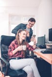 Colleagues using mobile phone together royalty free stock images Colleagues using mobile phone together royalty free stock images