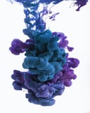 Color ink drop in water. Cyan, blue violet.