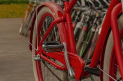 Colored bikes in a row stock photos Colored bikes in a row stock photos
