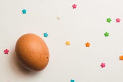 A colored chicken egg and pastry decorations royalty free stock photos A colored chicken egg and pastry decorations royalty free stock photos