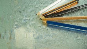 Colored pencils on wet glass royalty free stock image Colored pencils on wet glass royalty free stock image