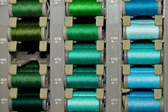 Colored threads on the coils stock photos Colored threads on the coils stock photos