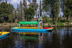Colorful boat also known as trajinera at Xochimilcos Floating Gardens - Mexico City, Mexico royalty free stock images Colorful boat also known as trajinera at Xochimilcos Floating Gardens - Mexico City, Mexico royalty free stock images