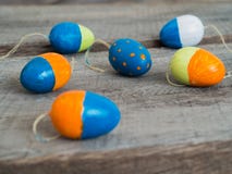 Colorful easter eggs on a wooden table. Some selfmade painted easter eggs on a wooden table - selective focus stock photo Colorful easter eggs on a wooden table. Some selfmade painted easter eggs on a wooden table - selective focus stock photo