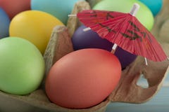 Colorful Easter eggs under umbrella in a box royalty free stock photo Colorful Easter eggs under umbrella in a box royalty free stock photo
