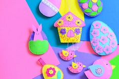 Colorful felt Easter DIY on flat felt sheets. Felt Easter eggs, house with birds, bunny decorations. Funny Easter background stock photography Colorful felt Easter DIY on flat felt sheets. Felt Easter eggs, house with birds, bunny decorations. Funny Easter background stock photography