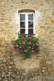 Colorful Flowers In Window Of Ancient Building Stock Photo