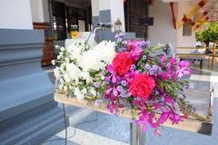 Colorful flowers on a wooden platform with a microphone royalty free stock photo Colorful flowers on a wooden platform with a microphone royalty free stock photo