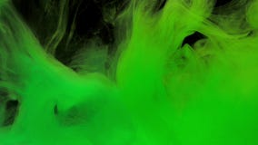 Colorful green ink mixing in water, swirling softly underwater with copy space stock video Colorful green ink mixing in water, swirling softly underwater with copy space stock video