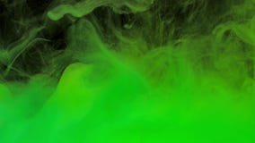Colorful green ink mixing in water, swirling softly underwater with copy space stock video footage Colorful green ink mixing in water, swirling softly underwater with copy space stock video footage