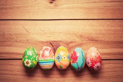 Colorful hand painted Easter eggs on wood. Unique handmade, vintage design. royalty free stock images Colorful hand painted Easter eggs on wood. Unique handmade, vintage design. royalty free stock images