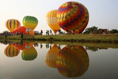 Colorful hot air balloons reflected in the water stock photos Colorful hot air balloons reflected in the water stock photos