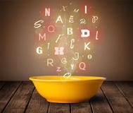 Colorful letters coming out of home cook soup bowl royalty free stock photo Colorful letters coming out of home cook soup bowl royalty free stock photo