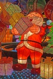 Colorful light decoration of Santa Claus laughing looking happy carrying piles of gift boxes