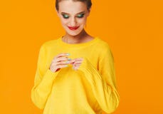 Colorful makeup woman red lips in yellow clothes on color happy summer fashion background manicured nails stock photo Colorful makeup woman red lips in yellow clothes on color happy summer fashion background manicured nails stock photo