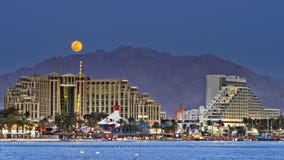 Colorful Moon Rise In Eilat City, Israel Stock Image