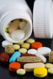 Colorful Pills Scattered From White Bottle Royalty Free Stock Photography Colorful Pills Scattered From White Bottle Royalty Free Stock Photography