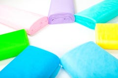 Colorful fabric rolls in warehouse - isolated on white background stock image Colorful fabric rolls in warehouse - isolated on white background stock image