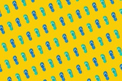 Colorful sandals in seamless photo on yellow background.design for holiday and summer concepts royalty free stock photography Colorful sandals in seamless photo on yellow background.design for holiday and summer concepts royalty free stock photography