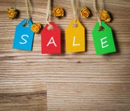 Colorful tags lettering sale with paper flowers. Stock Images Colorful tags lettering sale with paper flowers. Stock Images