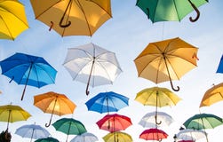 Colorful umbrellas flying in sky Colorful umbrellas flying in sky