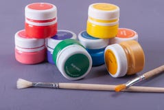 Plastic cans of paint and gouache. Art tools. stock photography Plastic cans of paint and gouache. Art tools. stock photography