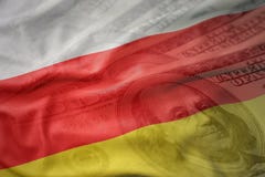 Colorful waving national flag of south ossetia on a american dollar money background. royalty free stock images Colorful waving national flag of south ossetia on a american dollar money background. royalty free stock images