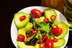 Colourful, healthy foods Avocado, Olive Oil, Apple Cider Vinegar, Cherry Tomatoes, Red Chilli`s Lettuce, for healthy eating habit stock photos Colourful, healthy foods Avocado, Olive Oil, Apple Cider Vinegar, Cherry Tomatoes, Red Chilli`s Lettuce, for healthy eating habit stock photos
