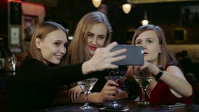 Company of young people is taking selfie in the bar stock video footage Company of young people is taking selfie in the bar stock video footage