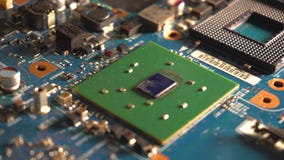 Components of the computer motherboard. Dolly shot. Over electronics Components of the computer motherboard. Dolly shot. Over electronics
