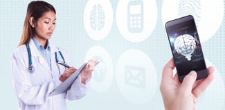 Composite image of asian doctor writing on files royalty free stock images Composite image of asian doctor writing on files royalty free stock images
