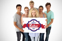 Composite image of group of teenagers holding a blank card stock image Composite image of group of teenagers holding a blank card stock image