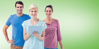 Composite image of group of three persons using tablet Stock Images Composite image of group of three persons using tablet Stock Images