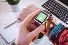 Composite image of hand using smart watch royalty free stock photo Composite image of hand using smart watch royalty free stock photo