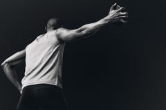 Composite image of low angle view of sportsman is practising discus throw stock photography Composite image of low angle view of sportsman is practising discus throw stock photography